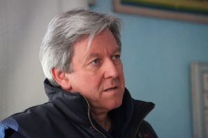 Headshot of man with grey hair