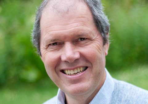 Head shot of a man smiling at the camera
