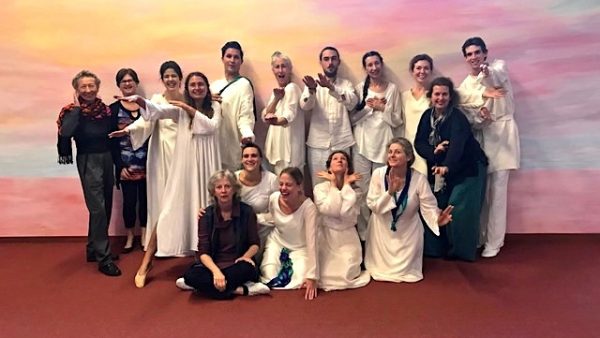 a picture of students of eurythmy dressed in long veils and tights