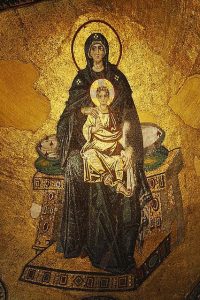 photo of icon of Mary Mother of God form the Hagia Sophia in modern Istanbul. Colours are golds, browns and blacks. The child is seated on Mary's lap